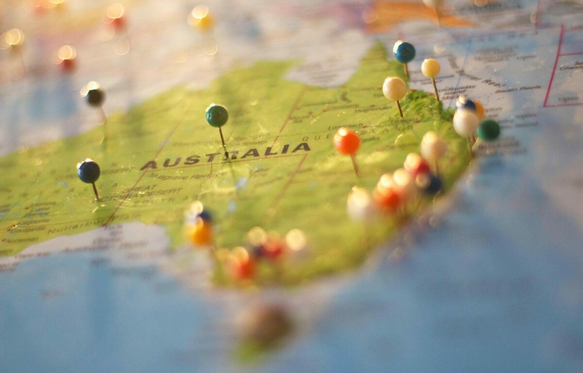 Close-up of an Australia map with pins placed across the country, symbolizing USA to Australia pet relocation planning.
